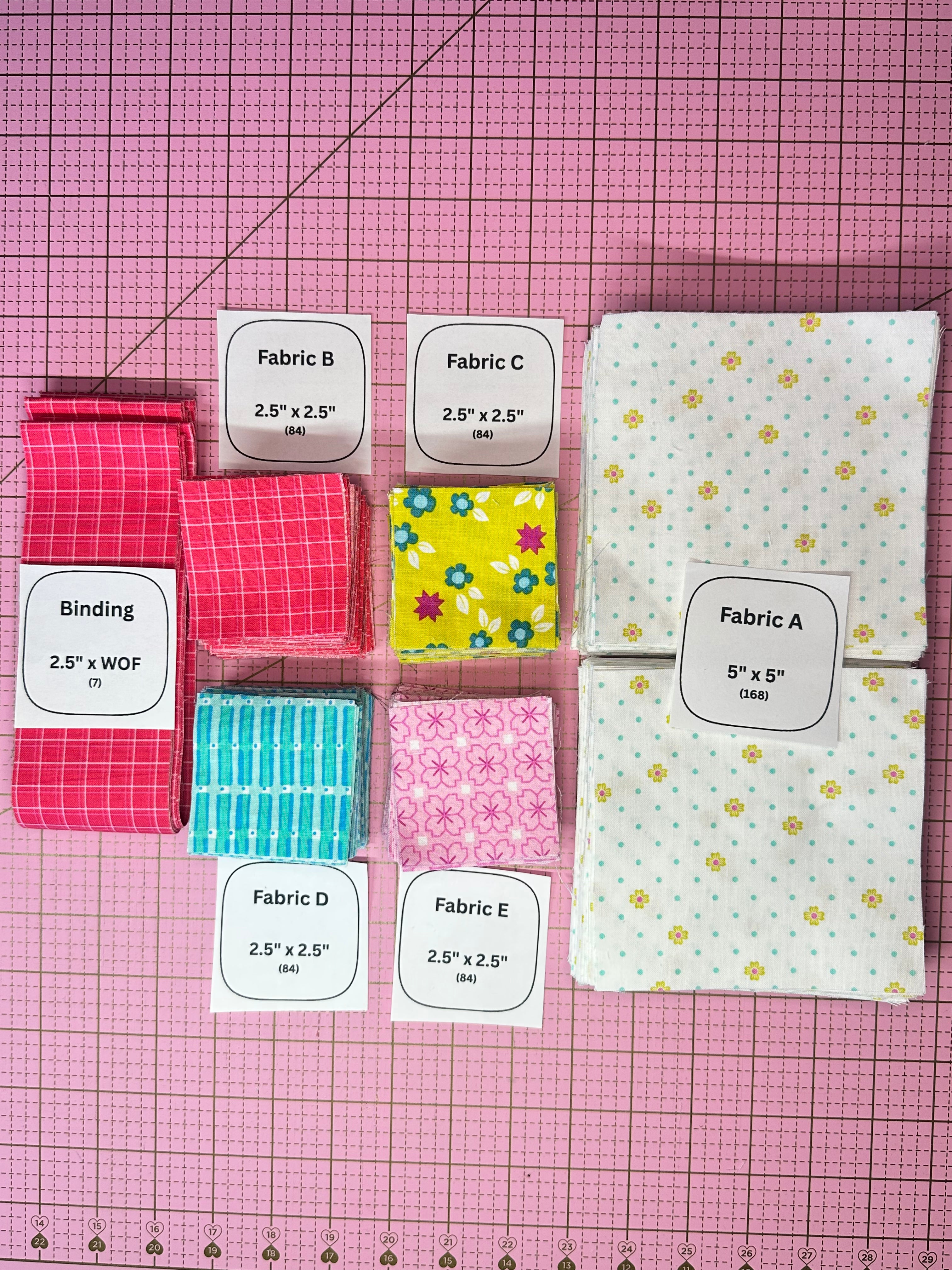 Collection of fabric samples with labels on a grid background