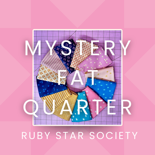 ruby star society fabrics on pink cutting mat